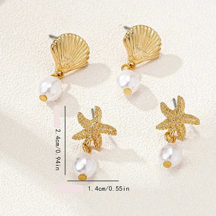 Boucles d'oreilles dorées coquillage étoile de mer et perle