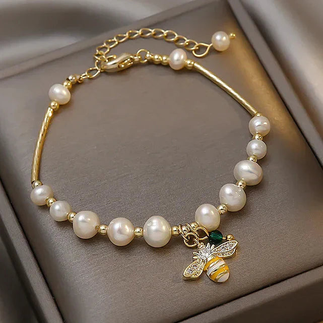 Bracelet avec perles blanches abeille