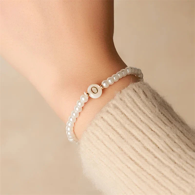 Bracelet blanc initiale o