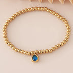 Bracelet doré avec pierre de naissance pour femme