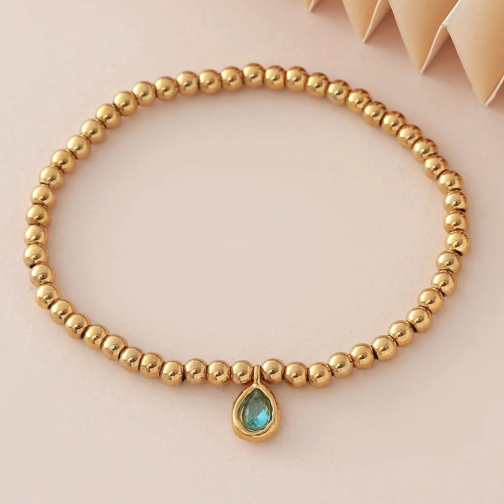 Bracelet doré avec pierre de naissance pour femme