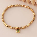 Bracelet doré avec pierre de naissance pour femme