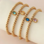 Bracelet doré avec pierre de naissance pour femme