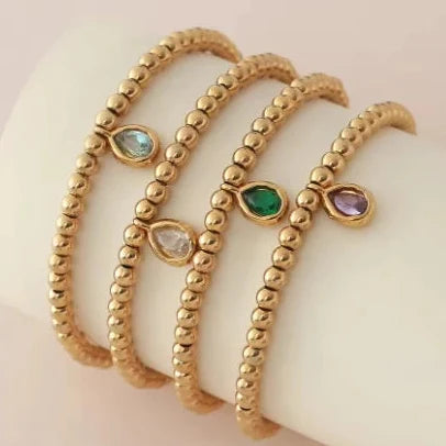 Bracelet doré avec pierre de naissance pour femme