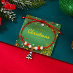 クリスマスツリーモチーフのレッドペンダント付きコードブレスレット