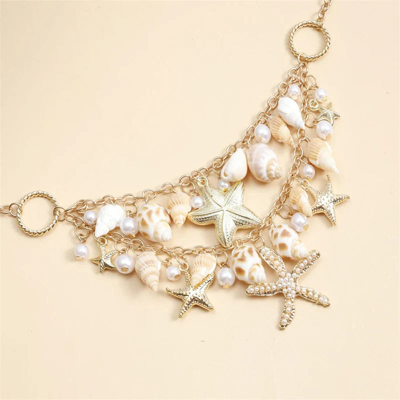 Collier avec grand pendentif coquillages et étoiles de mer