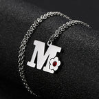 Collier avec pendentif initiale et fleur m