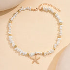 Collier ras du cou coquillage et étoile de mer blanc larges perles