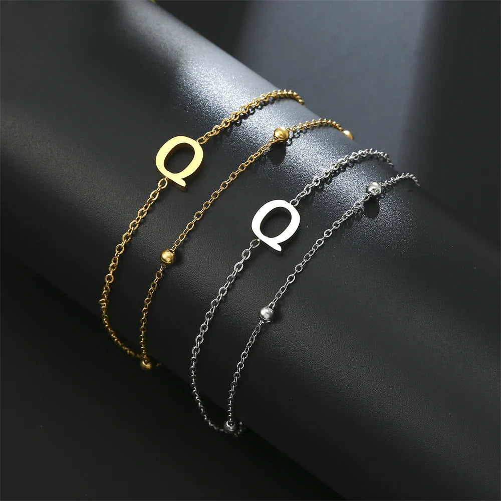 Bracelet double initiale or et argent  q