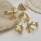 Lot de 4 bagues coquillage et étoiles de meror